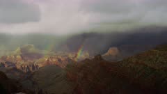 Stormy weather and double rainbows near South Rim entrance of the Grand Canyon