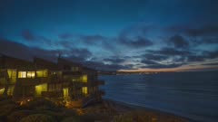 Sunset over ocean and beach houses in Monterey