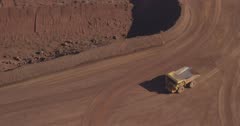 Dump trucks in an open cut Iron Ore mine near the town of Newman, Western Australia