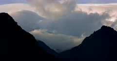 Time Lapse of the Fiordland silhouetted hills with clouds moving in the valleys