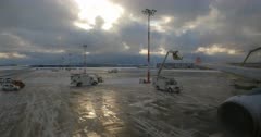 A view from the aircraft passenger window of the deicing of the planes wings before take off, at Istanbul Airport that is covered in snowed .