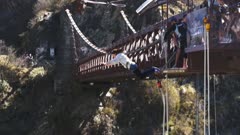close up of a thrill seeker jumping off the bridge at kawarau gorge in new zealand- recorded at 60fps