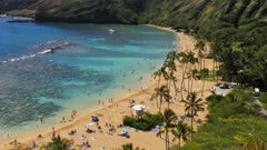 close up panning shot of the beach and reef at the popular snorkeling location, hanauma bay in hawaii