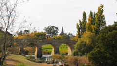 long shot of the historic old stone bridge in richmond, tasmania, the oldest bridge still being used in australia