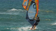 close up of three windsurfers at the world famous ho'okipa beach, maui