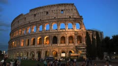tourists and the colosseum in rome, italy, a famous ancient arena for gladiatorial contests