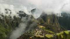 time lapse of peru's famous lost inca city of machu picchu on a misty morning