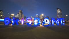 night shot of the large brisbane letters changing colors at south bank in brisbane, queensland