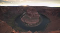 wide sunset pan of horseshoe bend near page in the american state of arizona