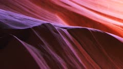 close up pan of a beautifully lit sandstone wall of upper antelope canyon in page, arizona
