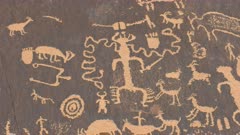 close up of strange ancient american indian art figures and symbols on newspaper rock at canyonlands national park in utah, usa