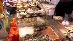 a customer buying prawns at chun yeung market in hong kong, china