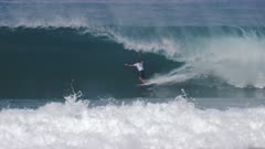 4K 60p shot of kelly slater in a closeout barrel at pipeline on the island of oahu in hawaii