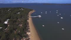 an aerial view flying east of coochiemudlo island at morton bay in queensland, australia