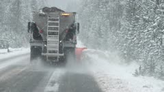 slow motion clip of a snow plow clearing part of the grand loop road in yellowstone national park of wyoming, usa