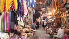 a 4 axis gimbal steadicam clip walking past market stalls in marrakesh, morroco