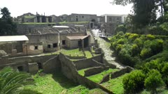 walls and ruined buildings as viewed from the main entrance to the pompeii ruins near naples, italy
