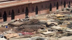 close high angle view of workers at an ancient tannery in marrakesh, morroco