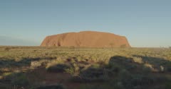 8K late afternoon clip of uluru with lengthening shadows in uluru-kata tjuta national park of the northern territory, australia