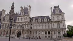 a spring morning panning shot of the front of the hotel de ville in paris, france