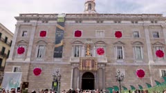 a tilt up clip of palau de la generalitat de catalunya decorated for sant jordi day in barcelona, spain