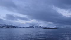 Pov shot from motor boat driving in norwegian fjord, wide frontal gimbal shot