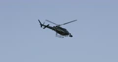 Police helicopter over Las Vegas Nevada Strip resorts. Spotlight and cameras for pursuit of criminals or aid in law enforcement. Aerial ability to follow vehicles and flight overhead of a dangerous situation on the ground. 4K HD video footage. Despain Rekindle Photo. 1103