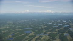 Aerial of the wide glacial-carved Matanuska-Susitna Valley, with Denali in the distance