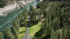UHD 8k aerial of small hydro electic powerplant dam on river in easter oregon or idaho