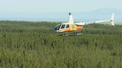 Alaska - September, 2017: Aerial view Tanalian R44 helicopter flying Turnagain Arm mountain region near Anchorage Pacific ocean USA