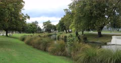 Tree lined river in Christchurch, New Zealand downtown 4K