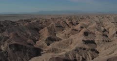 Aerial Drone Shot over Ocotillo Wells Bad Lands, flying high over multiple ridges and valleys