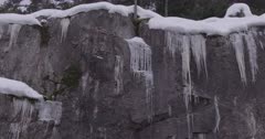 4K Icicles along rock face in the snow - SLOG2 Not Colour Corrected 