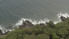 Maupiti Aerial coastline with trees High angle track shot