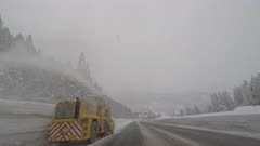 Driving Past Snow Clearing Machinery On Highway