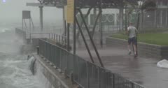 Man Jogging In Hurricane Wind And Rain