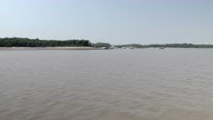 View of the river Rio Negro in the Amazon rainforest in Brazil from a boat sailing down the river