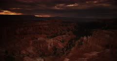 Monsoon storm clouds roil over the Bryce Canyon Ampitheatre at magic hour.  