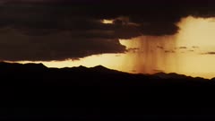Summer thunderstorm and monsoon with distant rain shaft roaming through the desert.  #1