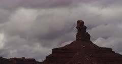 Storm clouds gather over the desert buttes of the Valley of the Gods near Monument Valley.