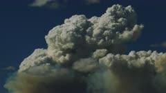 Pyrocumulus Clouds (fire clouds, smoke clouds) created by raging wildfires in the mountainous western states, roil the otherwise dreamy blue sky. 