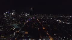 Aerial view of drone flying towards CN Tower shooting fireworks in Toronto, Canada