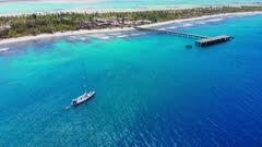 Aerial shot of Sailing Yacht at anchor close to Christmas Island shore, Kiribati