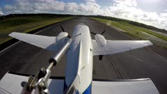 Twin Engined aircraft accelerates down runway and takes off. External mounted action cam.