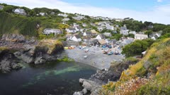 Scenic static shot of small cove and fishing village in Cornwall, UK