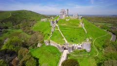 Aerial shot orbiting Castle ruins in Dorset England
