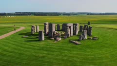 Drone aerial shot orbiting Stonehenge on a sunny day, Wiltshire. UK