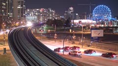 Timelapse of city tram near Creekside Park at night, Vancouver, British Columbia, Canada, North America