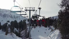 Going up the ski lift at La Plagne ski resort, Tarentaise, Savoy, French Alps, France, Europe