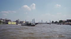 Bangkok's skyline from ferry crossing Chao Phraya River, Bangkok, Thailand, Southeast Asia, Asia